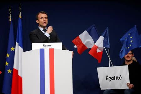 Emmanuel Macron, head of the political movement En Marche !, or Onwards !, and candidate for the 2017 presidential election, attends a meeting in Reims, France, March 17, 2017. REUTERS/Pascal Rossignol