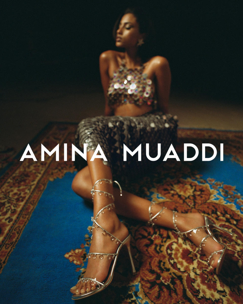 Model Imaan Hammam poses in Amina Muaddi shoes for the spring 2022 campaign. - Credit: Amina Muaddi