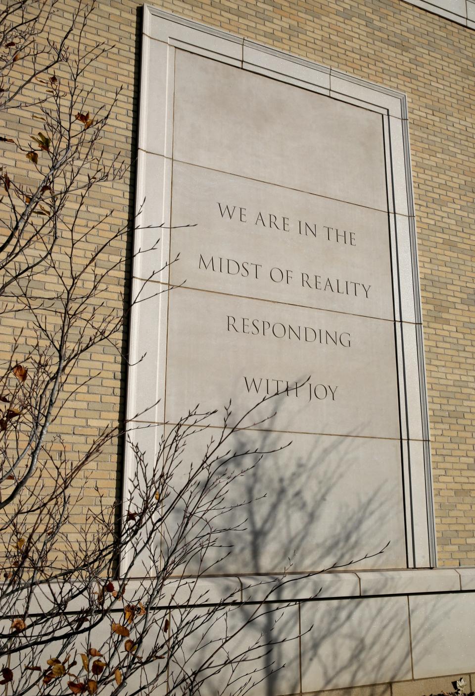 A carved limestone panel with the inscription “ We are in the midst of reality responding with joy” by Jenny Holzer exists on the west facade of the Raclin Murphy Museum of Art Thursday, Nov. 16, 2023, on the campus of the University of Notre Dame.