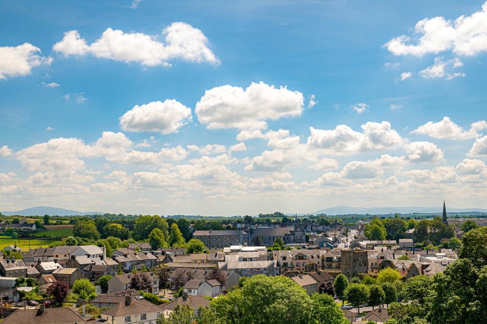 Aerial view of city against cloudy sky during sunny day, Cashel, Tipperary, Ireland