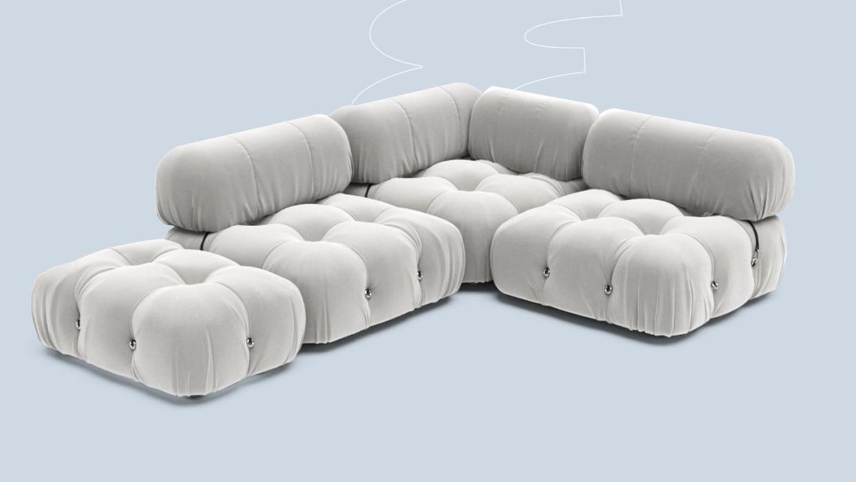 a white couch with a white pillow