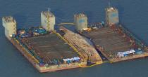 The damaged Sewol ferry was held afloat between two barges during a salvage operation off the South Korean island of Jindo, on March 23, 2017