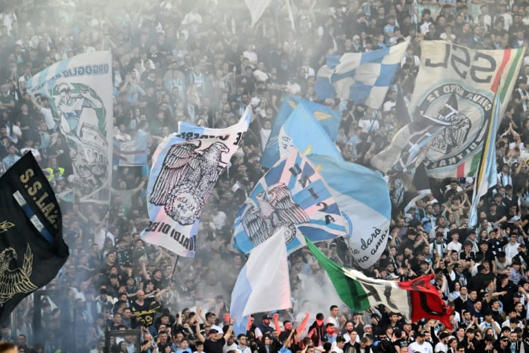 Hardcore <a class="link " href="https://sports.yahoo.com/soccer/teams/lazio/" data-i13n="sec:content-canvas;subsec:anchor_text;elm:context_link" data-ylk="slk:Lazio;sec:content-canvas;subsec:anchor_text;elm:context_link;itc:0">Lazio</a> and <a class="link " href="https://sports.yahoo.com/soccer/teams/roma/" data-i13n="sec:content-canvas;subsec:anchor_text;elm:context_link" data-ylk="slk:Roma;sec:content-canvas;subsec:anchor_text;elm:context_link;itc:0">Roma</a> fans have longstanding links with extreme right politics (Alberto PIZZOLI)