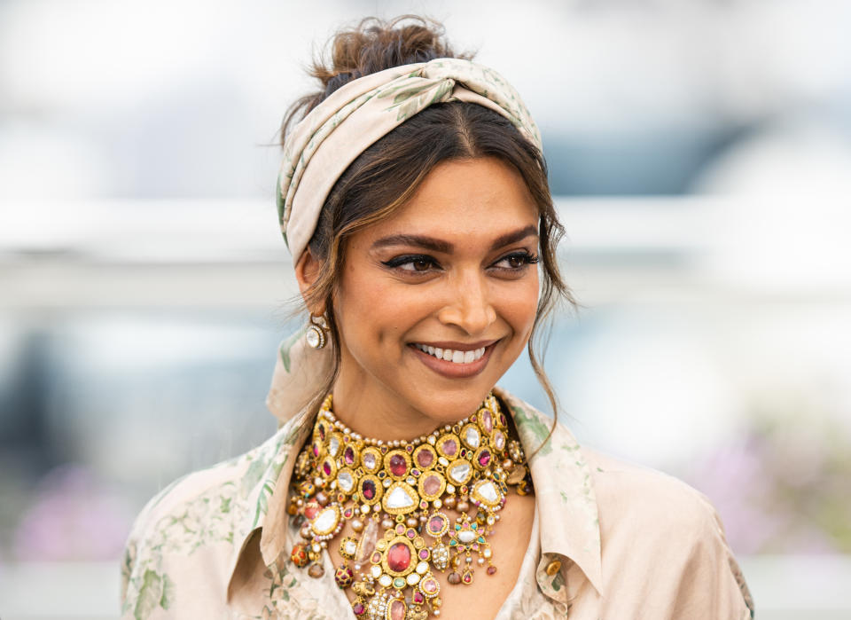 gold CANNES, FRANCE - MAY 17:  Deepika Padukone attends the photocall for the Jury during the 75th annual Cannes film festival at Palais des Festivals on May 17, 2022 in Cannes, France. attends the photocall for the Jury during the 75th annual Cannes film festival at Palais des Festivals on May 17, 2022 in Cannes, France. (Photo by Samir Hussein/WireImage)