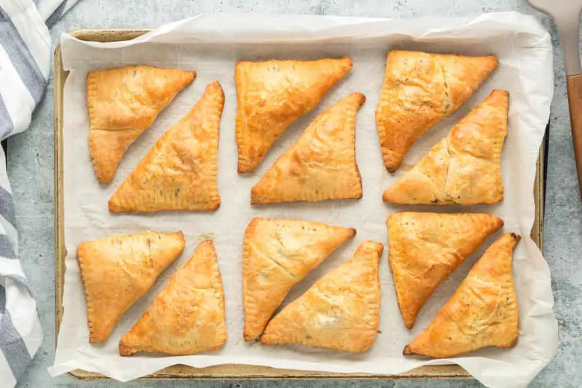 <p>Cooking & Cussing</p><p>Savory hand pies made with flaky crescent roll dough filled with a rich and meaty filling. These easy and quick pies are perfect football food but also make a standout weeknight dinner when paired with a simple salad.</p><p><strong>Get the recipe: <a href="https://cookingandcussing.com/louisiana-meat-pies/" rel="nofollow noopener" target="_blank" data-ylk="slk:Louisiana Meat Pies;elm:context_link;itc:0;sec:content-canvas" class="link rapid-noclick-resp">Louisiana Meat Pies </a></strong></p>