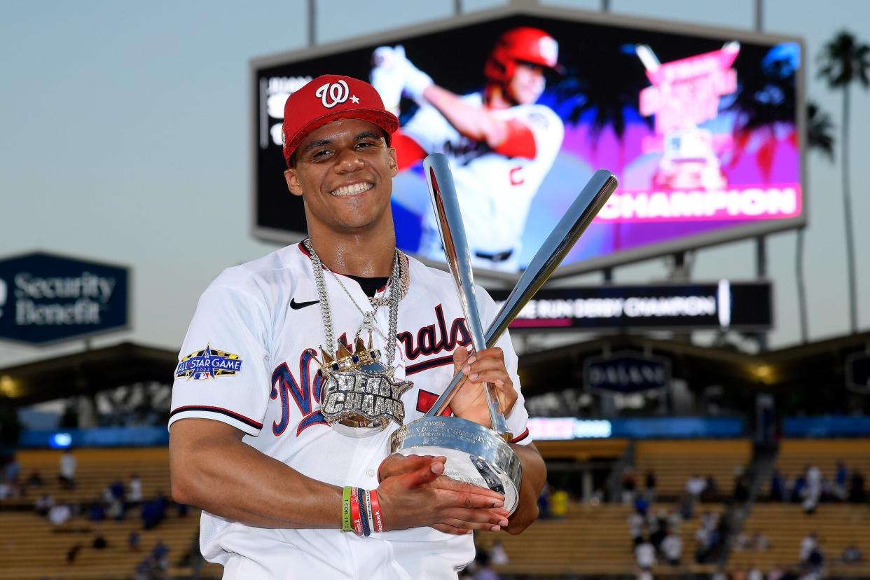 National League All-Star Juan Soto #22 of the Washington Nationals poses with the 2022 T-Mobile Home Run Derby trophy after winning the event at Dodger Stadium on July 18, 2022 in Los Angeles, California.