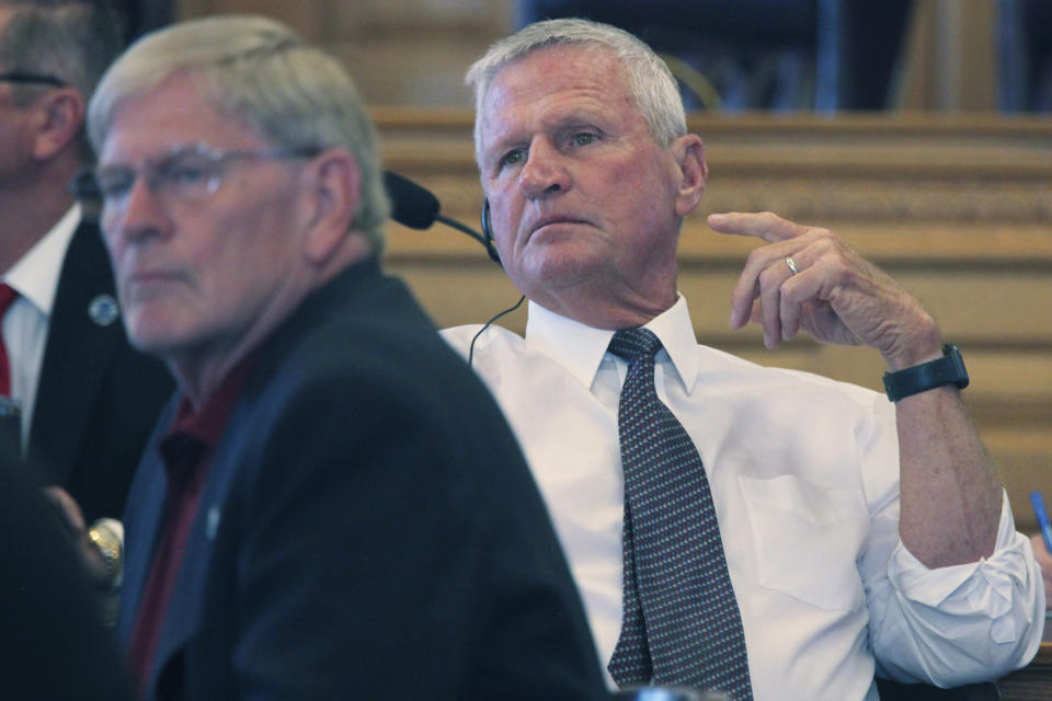 Kansas state Rep. Chuck Smith, R-Pittsburg, listens to comments about a proposal to help finance a new stadium in Kansas for the Super Bowl champion Kansas City Chiefs during a meeting of GOP lawmakers, Tuesday, June 18, 2024, at the Statehouse in Topeka, Kansas. The plan also would allow the state to help finance a new stadium for professional baseball's Kansas City Royals. (AP Photo/John Hanna)