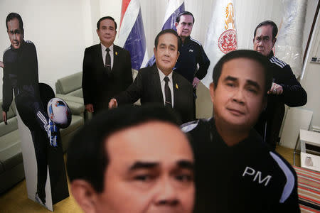 FILE PHOTO: Cardboards cut-out of Thailand's Prime Minister Prayuth Chan-ocha are pictured at Government House in Bangkok, Thailand, January 9, 2018. Picture January 9, 2018. REUTERS/Athit Perawongmetha/File Photo