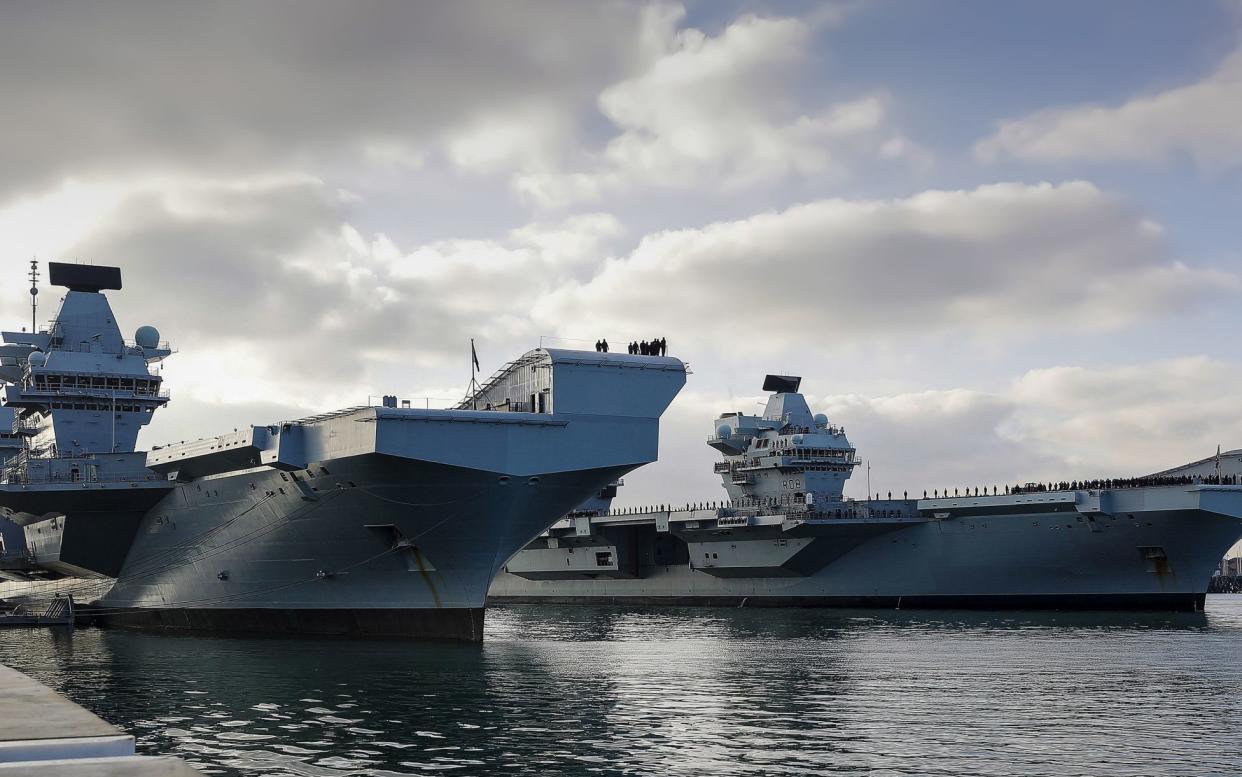 Undated handout photo issued by the Ministry of Defence of HMS Queen Elizabeth and HMS Prince of Wales, Britain's aircraft carriers, together in their home port of Portsmouth. The Royal Navy has spent Â£39 million repairing and maintaining its two giant aircraft carriers in the past year. PA Photo. Issue date: Saturday January 16, 2021. The costs include repairs to HMS Prince of Wales after it suffered two leaks. See PA story DEFENCE Carriers. Photo credit should read: LPhot Ben Corbett/MoD/Crown Copyright/PA Wire NOTE TO EDITORS: This handout photo may only be used in for editorial reporting purposes for the contemporaneous illustration of events, things or the people in the image or facts mentioned in the caption. Reuse of the picture may require further permission from the copyright holder. - Ben Corbett/PA Wire