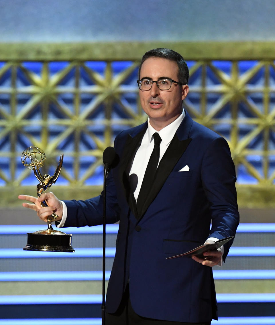 Host John Oliver accepts the Outstanding Writing for a Variety Series for "Last Week Tonight with John Oliver" onstage during the 69th Annual Primetime Emmy Awards at Microsoft Theater on Sept. 17, 2017 in Los Angeles, California.&nbsp;