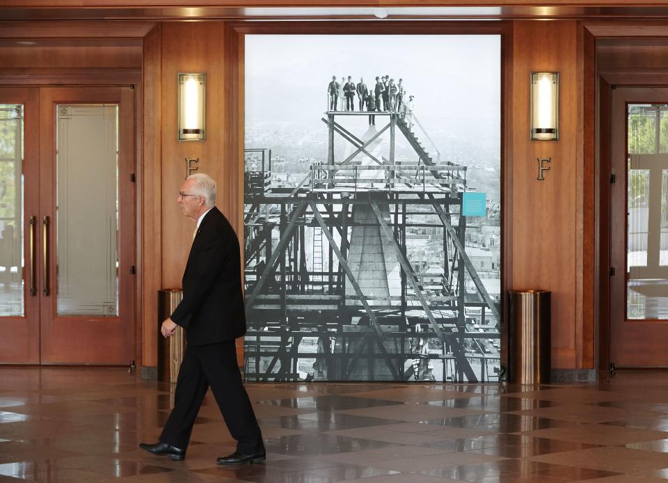An attendee walks past a historical photo during the 193rd Semiannual General Conference of The Church of Jesus Christ of Latter-day Saints at the Conference Center in Salt Lake City on Sunday, Oct. 1, 2023. | Jeffrey D. Allred, Deseret News