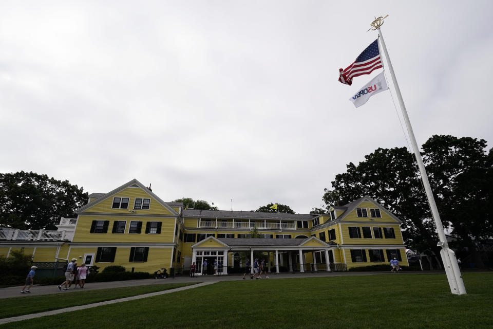 Fans walk past the clubhouse during the second round of the U.S. Open golf tournament at The Country Club, Friday, June 17, 2022, in Brookline, Mass. (AP Photo/Charlie Riedel)