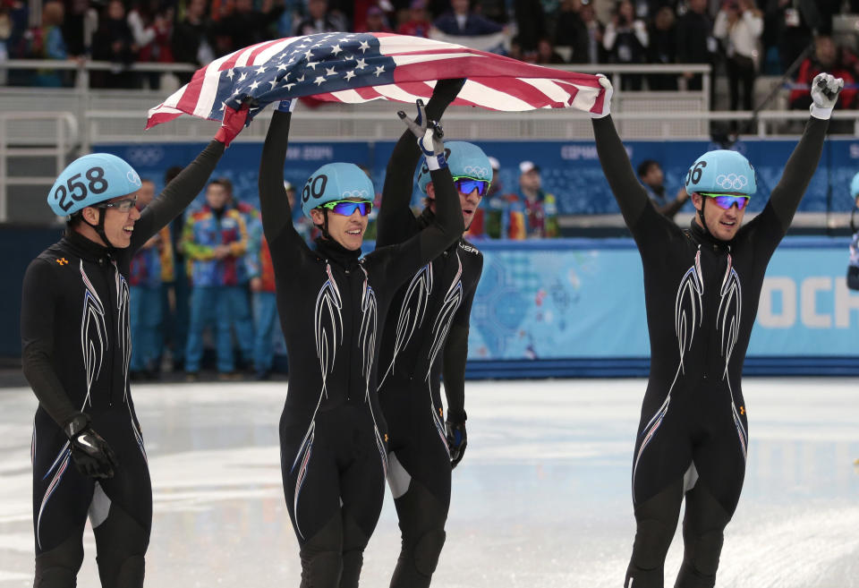 From left, J.R. Celski of the United States, Jordan Malone of the United States, Chris Creveling of the United States and Eduardo Alvarez of the United States celebrate their second place in the men's 5000m short track speedskating relay final at the Iceberg Skating Palace during the 2014 Winter Olympics, Friday, Feb. 21, 2014, in Sochi, Russia. (AP Photo/Ivan Sekretarev)