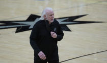 San Antonio Spurs head coach Gregg Popovich walks off the court after the team's loss against the Portland Trail Blazers in an NBA basketball game in San Antonio, Friday, April 16, 2021. (AP Photo/Eric Gay)