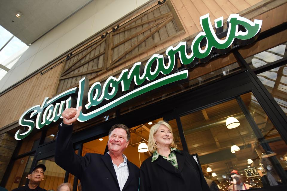 Stew Leonard Jr., the president & CEO of Stew Leonard's and Martha Stewart pose for photos in front of the store's sign during a VIP & Media Reception at Stew Leonard's at Paramus Park Mall on 09/16/19. 