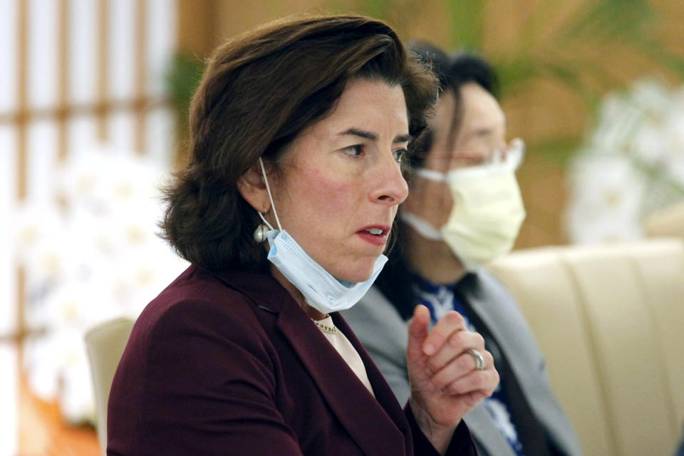 U.S. Secretary of Commerce Gina Raimondo talks with Japanese Foreign Minister Yoshimasa Hayashi during their meeting in Tokyo, Monday, Nov. 15, 2021. U.S. and Japanese officials agreed Monday to launch talks aimed at settling a dispute over American tariffs on imports of Japanese steel and aluminum. (AP Photo/Koji Sasahara, Pool)