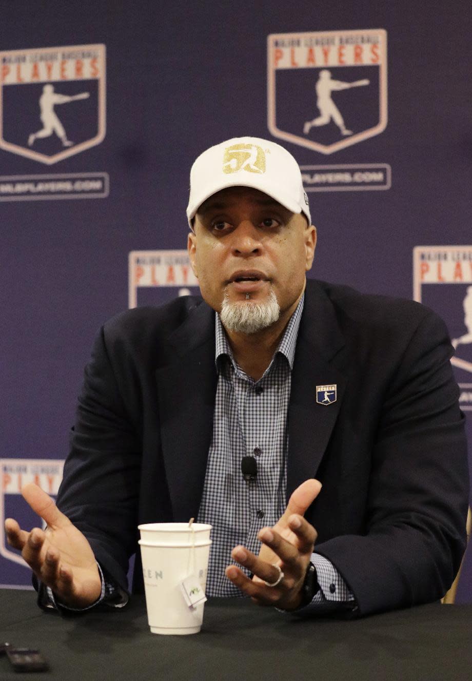 Executive Director of the Major League Players Association Tony Clark answers questions at a news conference Sunday, Feb. 19, 2017, in Phoenix. (AP Photo/Morry Gash)
