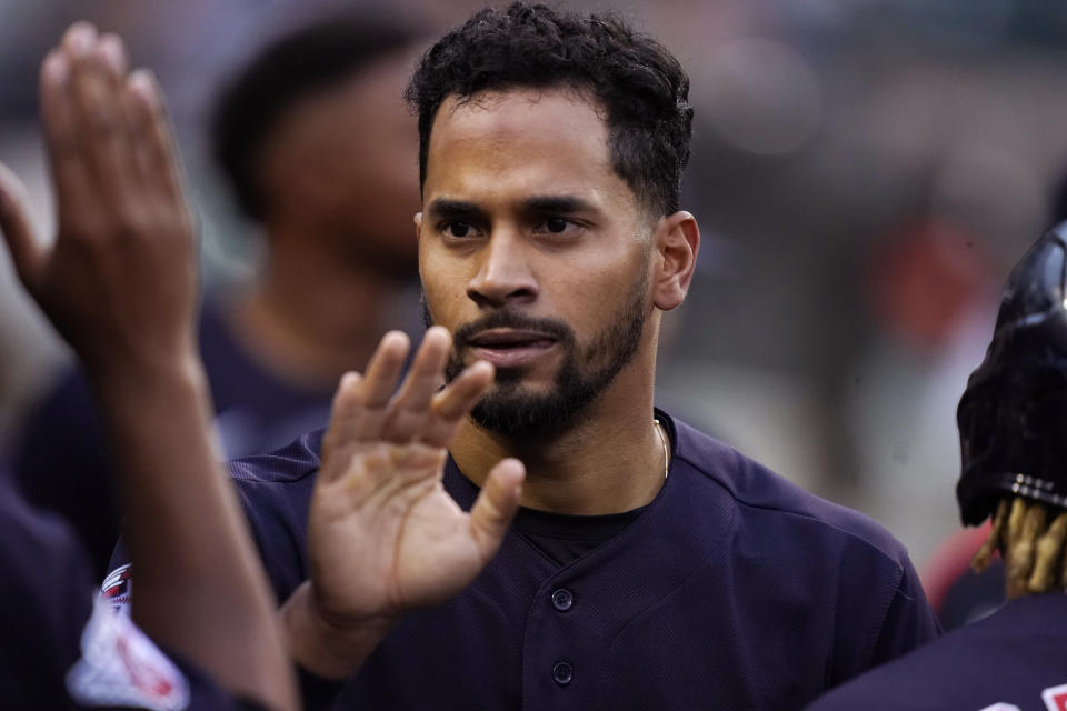 Cleveland Guardians' Oscar Mercado is greeted in the dugout after scoring during the third inning of a baseball game against the Detroit Tigers, Thursday, May 26, 2022, in Detroit. (AP Photo/Carlos Osorio)