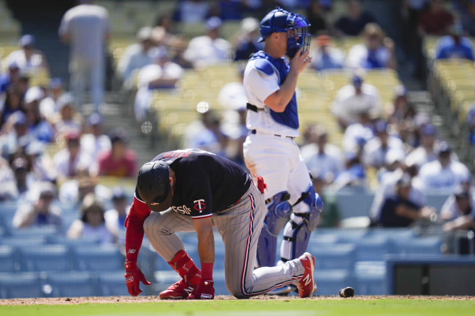 Minnesota Twins' Joey Gallo, left, reacts after being hit by a pitch from Los Angeles Dodgers relief pitcher Evan Phillips during the ninth inning of a baseball game in Los Angeles, Wednesday, May 17, 2023. (AP Photo/Ashley Landis)