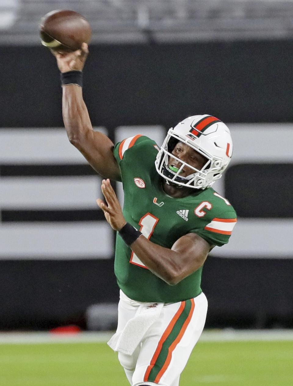 Miami quarterback D'Eriq King throws in the first quarter of an NCAA college football game against Florida State, Saturday, Sept. 26, 2020, in Miami Gardens, Fla. (Al Diaz/Miami Herald via AP)