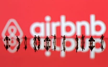 FILE PHOTO: A 3D printed people's models are seen in front of a displayed Airbnb logo in this illustration taken, June 8, 2016. REUTERS/Dado Ruvic/Illustration/File Photo