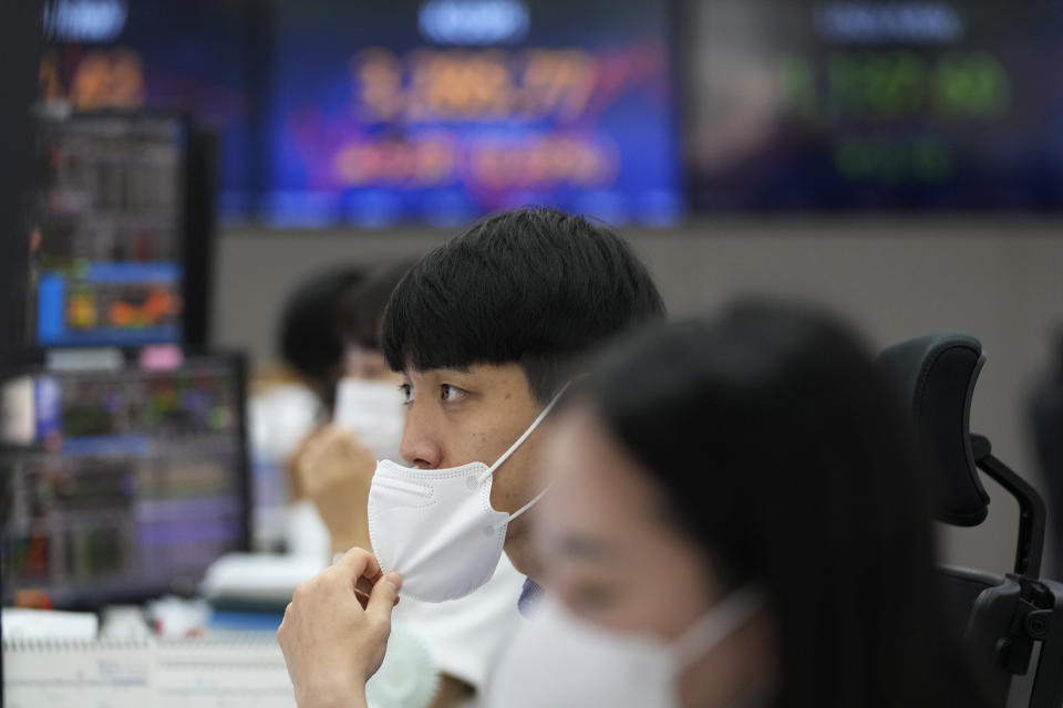 A currency trader watches monitors at the foreign exchange dealing room of the KEB Hana Bank headquarters in Seoul, South Korea, Thursday, June 24, 2021. Shares were mostly higher in Asia on Thursday after a listless day of trading on Wall Street as the recent bout of nerves over Federal Reserve policy fades. (AP Photo/Ahn Young-joon)