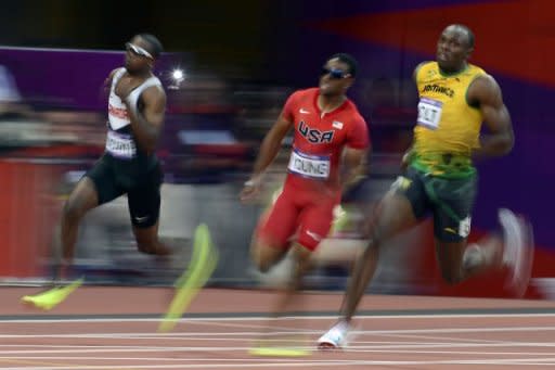 L-R: Canada's Aaron Brown, USA's Isiah Young and Jamaica's Usain Bolt compete in the men's 200m semi-finals at the athletics event of the London 2012 Olympic Games in London