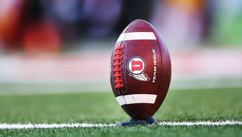 A football sits on the tee as kickers get warmed up as the Utes and Trojans prepare to play at Rice-Eccles Stadium in Salt Lake City on Saturday, Oct. 15, 2022.