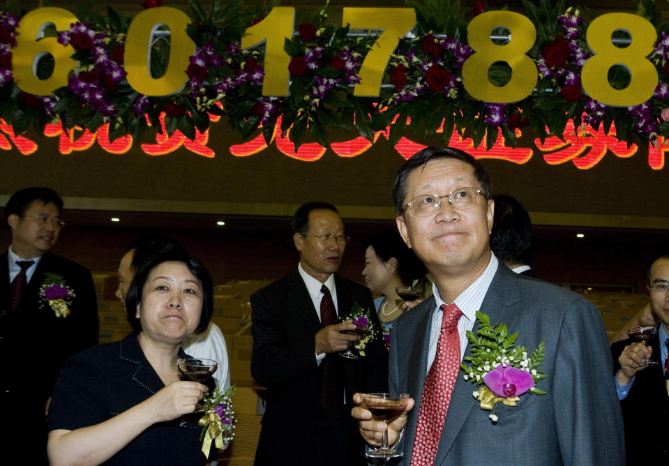 Tang Shuangning, right, then chairman of China Everbright Group and Everbright Securities Co., is pictured after toasting the IPO for Everbright Securities at Shanghai Stock Exchange in Shanghai, China on Aug. 18, 2009. The former chairman of state-owned Chinese bank China Everbright Group has been arrested on suspicion of embezzlement and bribery, prosecutors said in a statement Monday, Jan. 15, 2024, amid an intensified campaign against corruption. (Chinatopix via AP)