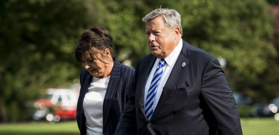 Viktor and Amalija Knavs, parents of First Lady Melania Trump, walk toward the White House after disembarking from Marine One with President Donald Trump, the First Lady and their son Barron