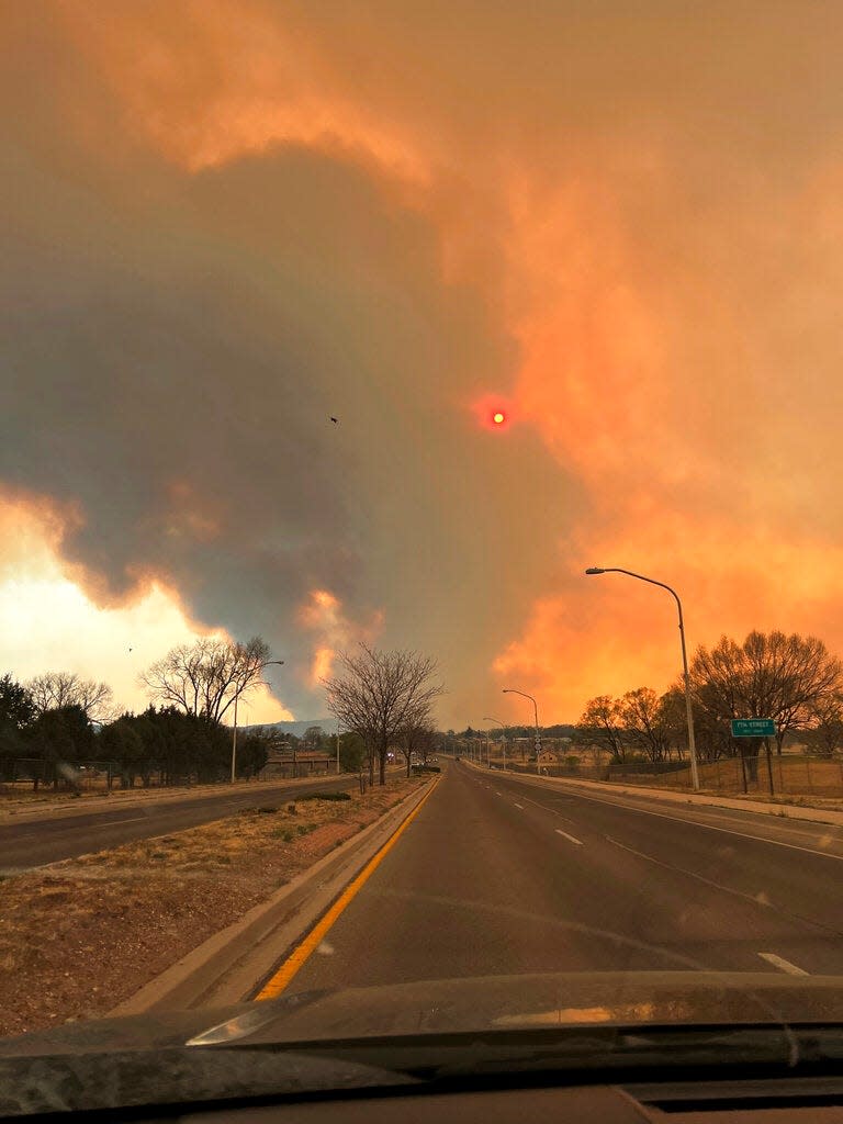 This photo provided by Renee Valdez shows plumes of smoke rising into the air, from wildfires in Las Vegas, N.M. on Monday, May 2, 2022. New Mexico was in the bull's eye for the nation's latest wave of hot, dry and windy weather.