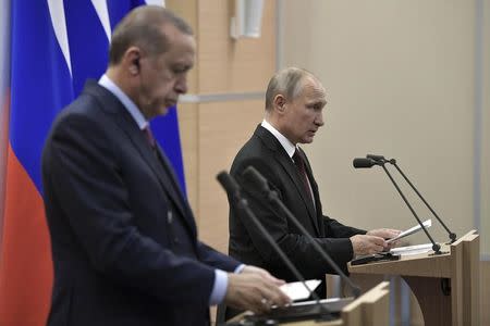 Russia's President Vladimir Putin (R) and Turkey's President Tayyip Erdogan attend a news conference after the talks in Sochi, Russia November 13, 2017. Sputnik/Alexei Nikolsky/Kremlin via REUTERS