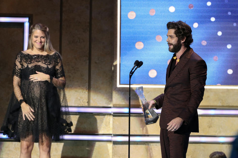 Thomas Rhett, right, accepts his award from his wife, Lauren Akins, at 2019 CMT Artists of the Year at Schermerhorn Symphony Center on Wednesday, Oct. 16, 2019, in Nashville, Tenn. (Photo by Al Wagner/Invision/AP)