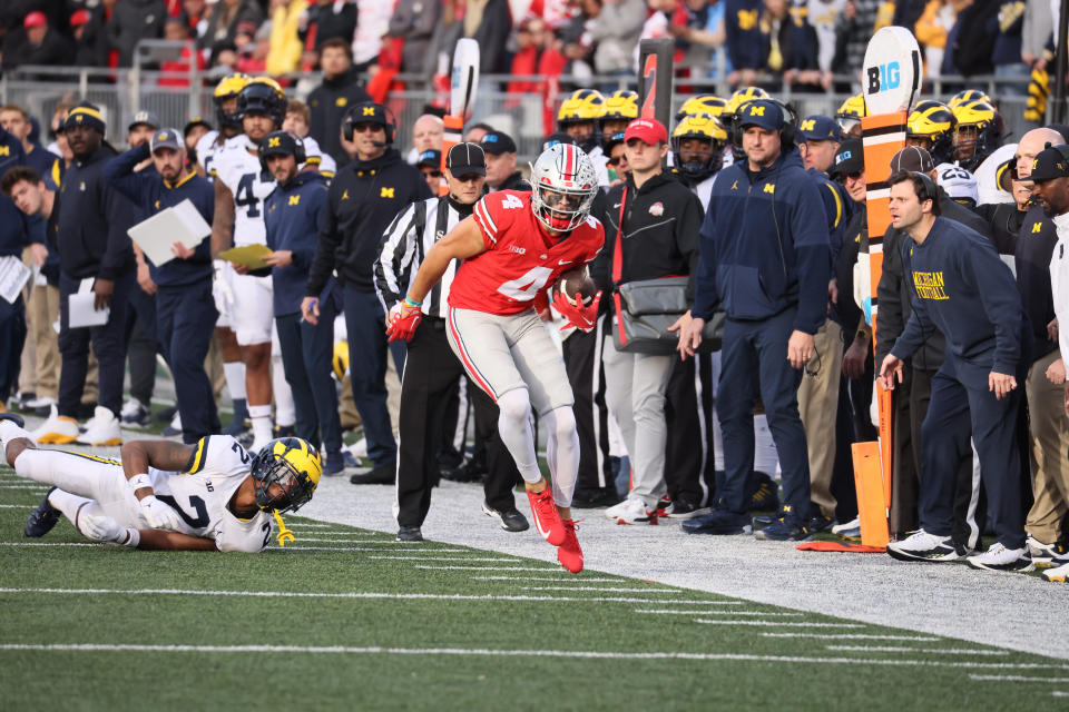 Suspended Michigan football analyst Connor Stalions, who is at the center of an NCAA sign-stealing investigation, can be seen standing behind Michigan head coach Jim Harbaugh during a game against Ohio State on Nov. 26, 2022. (Photo by David E. Klutho/Sports Illustrated via Getty Images)