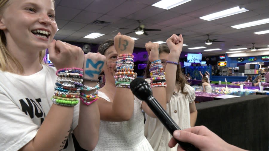 <em>Friends Brynlee Scheodter, Ava Grant, and Maloory Meeks show off their Taylor Swift-themed bracelets</em>