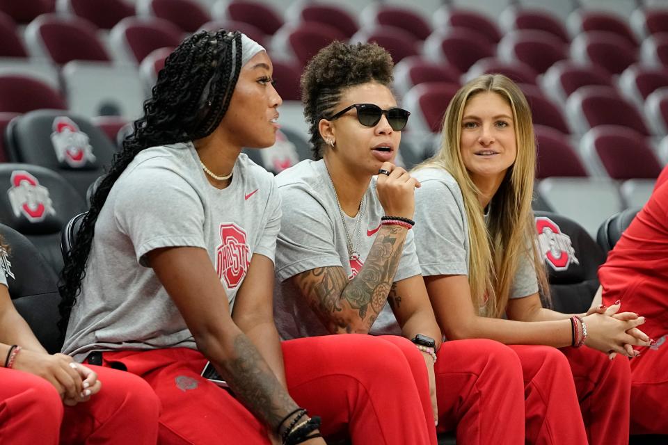From left, Ohio State forward Cotie McMahon, and guards Rikki Harris and guard Jacy Sheldon sit together during a practice at Value City Arena.