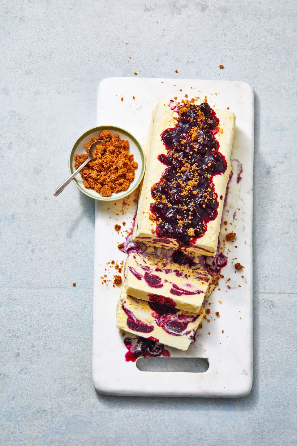 <p>Think of this frozen dessert like the soft-serve version of your favorite ice cream cake, with added tang from crème fraîche and crunch from the pecan crumble. <em>Yum.</em></p><p>Get the <strong><a href="https://www.goodhousekeeping.com/food-recipes/a36663530/semifreddo-with-berries-recipe/" rel="nofollow noopener" target="_blank" data-ylk="slk:Blueberry Crème Fraîche Semifreddo With Pecan Crumble recipe" class="link ">Blueberry Crème Fraîche Semifreddo With Pecan Crumble recipe</a></strong>.<br></p>