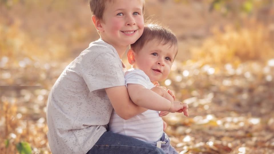 Koda, 4, poses with his baby brother Hunter, 9 months, in a beautiful family photo. Photo: AAP