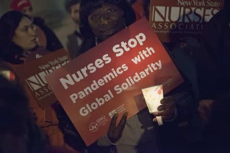 Nurses from the New York State Nurses Association protest for improved Ebola safeguards, part of a national day of action, in New York City November 12, 2014. REUTERS/Mike Segar