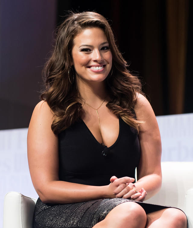 Ashley Graham displays bouncing bosom while jumping on her bed in