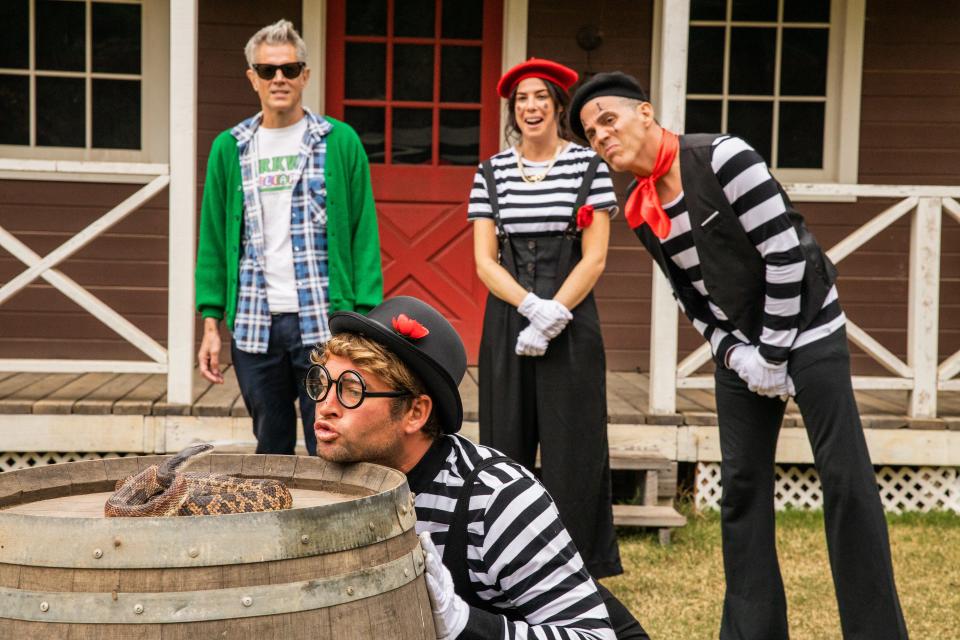 Sean "Poopies" McInerny (center bottom) is tasked with kissing a snake as Johnny Knoxville, Rachel Wolfson and Steve-O look on in "Jackass Forever."