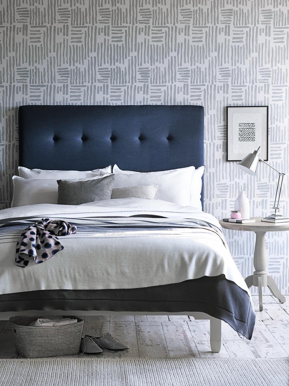 <p> Want to keep your walls neutral? We love this modern linear wallpaper in soft gray, it sets the tone for the rest of the scheme and makes it easy to use the same shade throughout with bedding and accessories. </p> <p> Then, choose a navy-colored bed as the focal point. Blue and gray are a good combination and you can play with different tones for extra interest.&#xA0; </p>