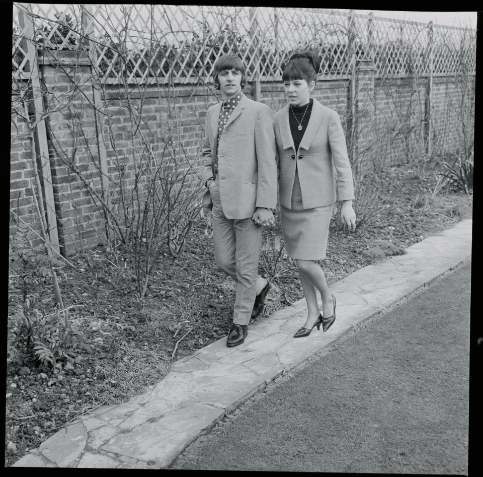 <p>Ringo Starr and his bride Maureen stroll hand-in-hand outside their honeymoon retreat in Sussex, England. The bride was just 18-years-old.</p>