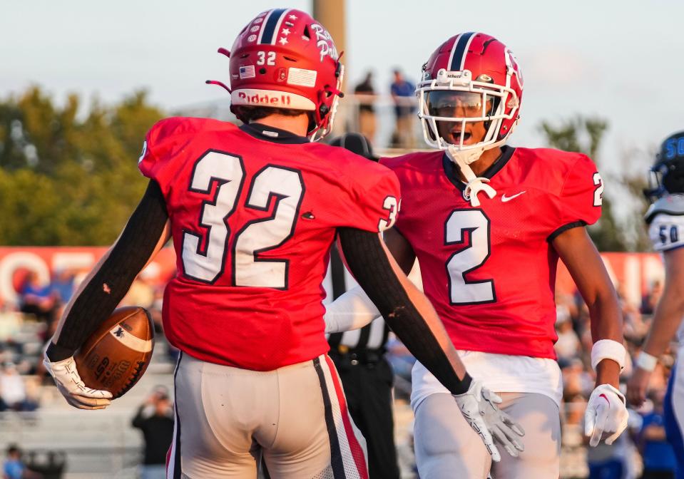 Plainfield Quakers Jamir Bouie (2) yells in excitement with Plainfield Quakers running back Luke Starnes (32) on Friday, Sept. 29, 2023, during the game at Plainfield High School in Plainfield. The Plainfield Quakers defeated the Franklin Community Grizzly Cubs, 38-3.