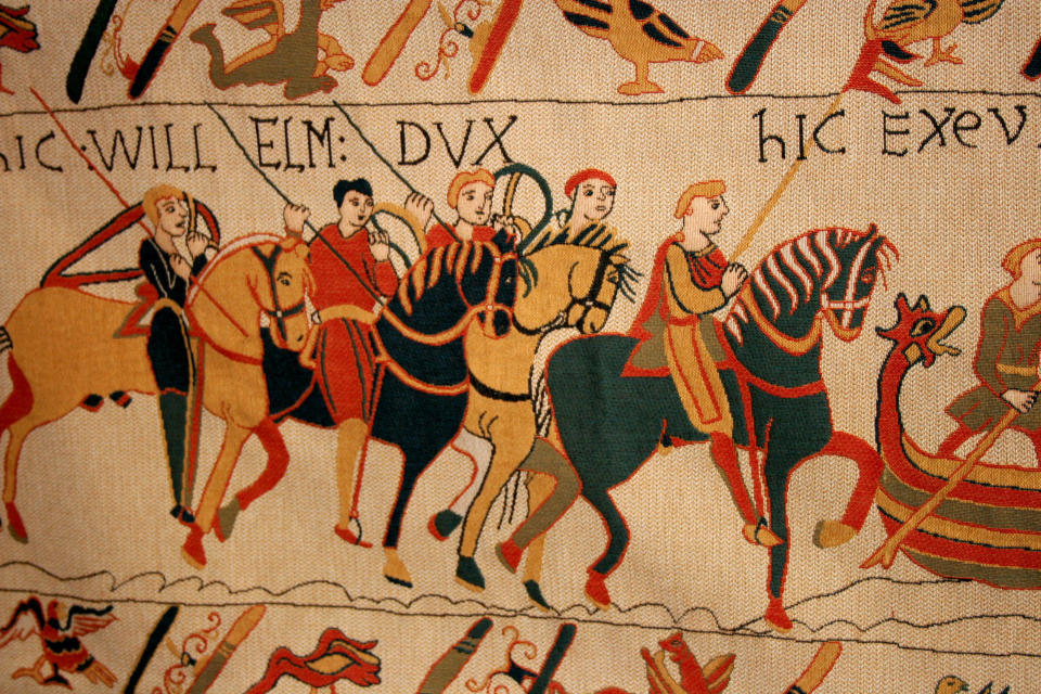 This undated image released by Atout-France shows a close up of the Bayeux Tapestry in Bayeau, France. The nearly thousand-year-old treasure, which is actually more of an embroidered scroll, depicts the story of how William, the duke of Normandy, became king of England. Billed as the first major town liberated by the Allies, Bayeux was miraculously spared damage during the war. Today, the old town center boasts cobblestone streets, upscale shops, small eateries and picturesque mills along the narrow Aure River; lacemakers practice the intricate local art across from a cathedral with stunning Norman architecture. (AP Photo/Atout-France)