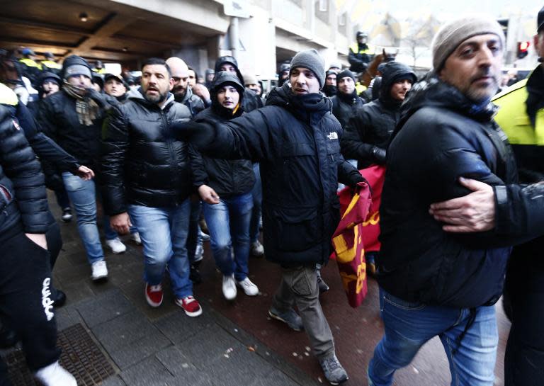 Police kettle AS Roma fans at the old harbour in Rotterdam before the Europa Cup match against Feyenood on February 26, 2015