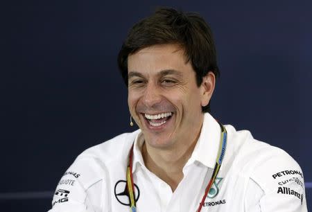 Mercedes Formula One Executive Director (Business) Toto Wolff smiles during a news conference after the second practice session of the Australian F1 Grand Prix at the Albert Park circuit in Melbourne March 14, 2014. REUTERS/Brandon Malone