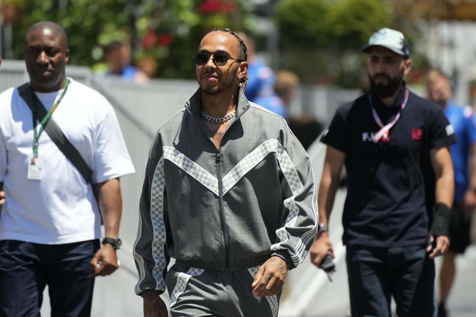 Mercedes driver Lewis Hamilton of Britain arrives at paddock prior to the third free practice at the Baku circuit, in Baku, Azerbaijan, Saturday, June 11, 2022. The Formula One Grand Prix will be held on Sunday. (AP Photo/Sergei Grits)