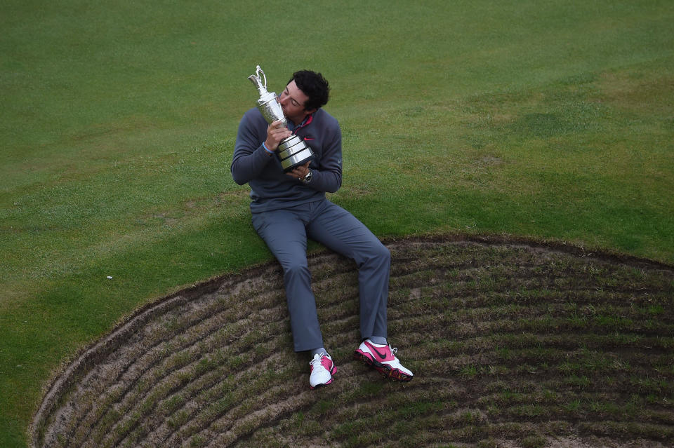 HOYLAKE, ENGLAND - JULY 20:  Rory McIlroy of Northern Ireland celebrates with the Claret Jug after his two-stroke victory after the final round of The 143rd Open Championship at Royal Liverpool on July 20, 2014 in Hoylake, England.  (Photo by Richard Heathcote/R&A/R&A via Getty Images)