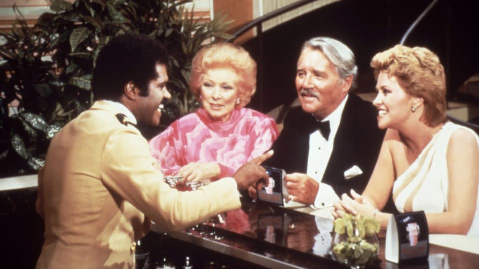 Hollywood stars Greer Garson, second from left, and Howard Duff, with series regulars Ted Lange, far left, and Lauren Tewes. - Everett Collection